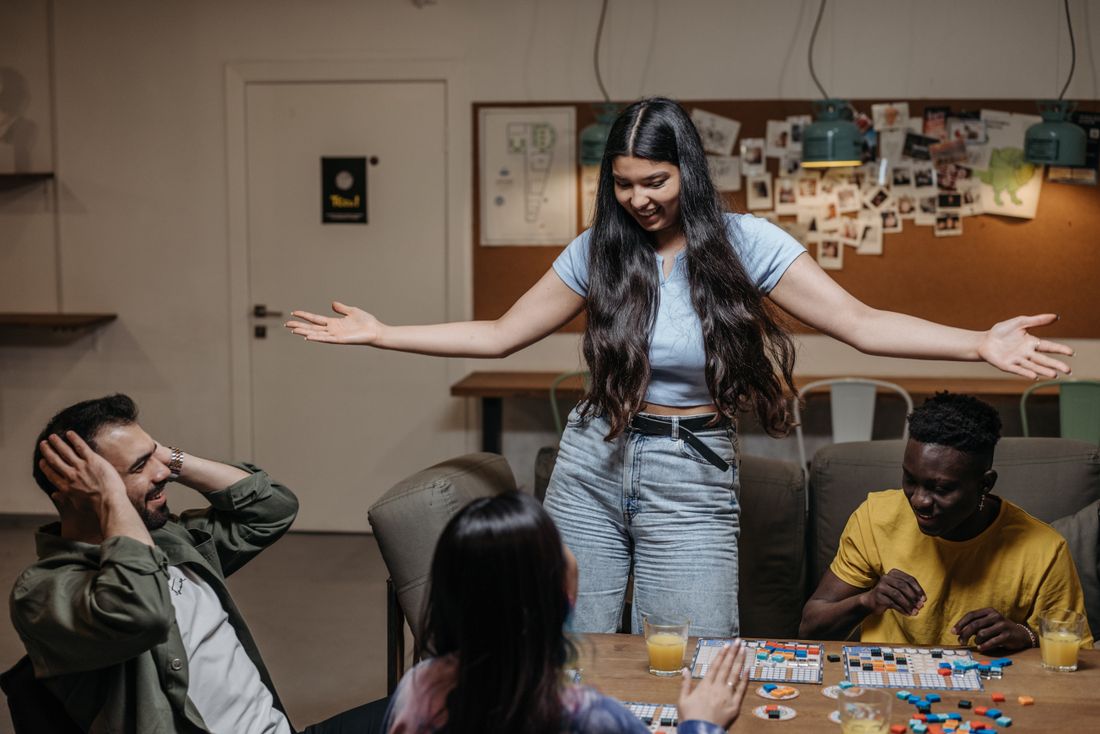 Friends playing a board game together